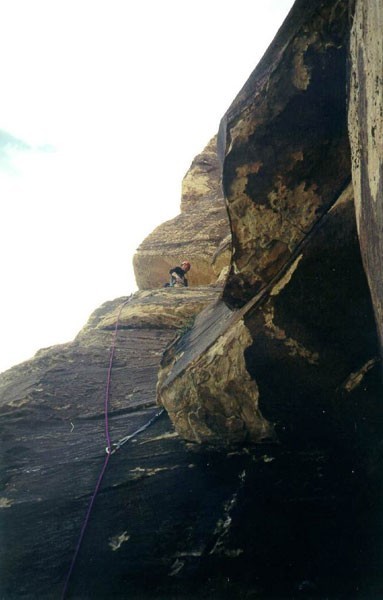 Looking up at a climber on pitch 4.