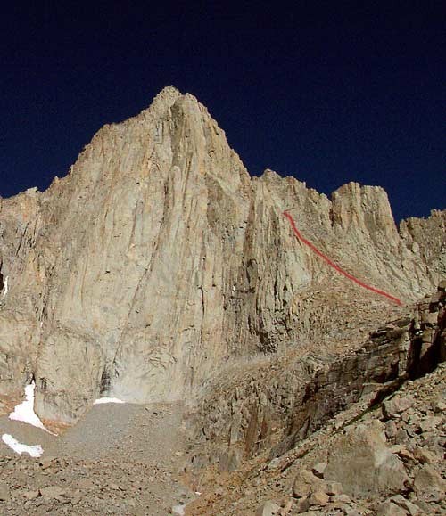 The route disappears behind the ridge and follows the gully to the sum...