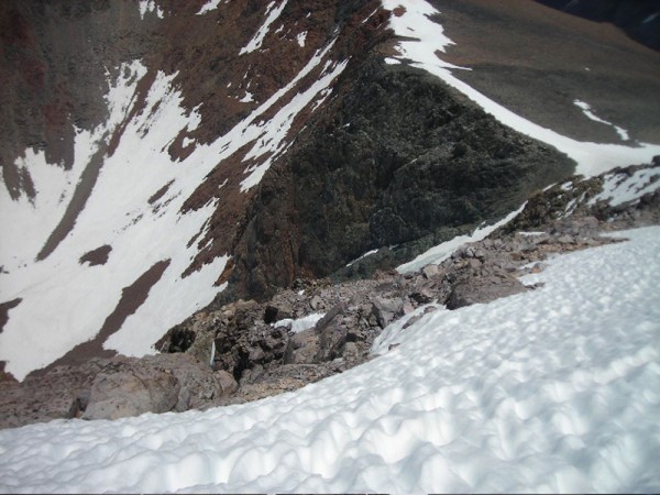 View looking down from high on the Dana Couloir on 6-22. Note snow in ...