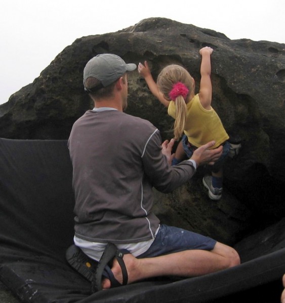 Chris spots Holly on one of her first boulder problems!
