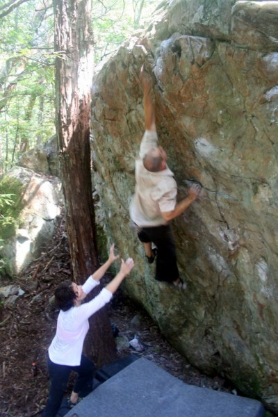 Elizabeth Brand spots Rob Bianco on a dyno variation to Intuition