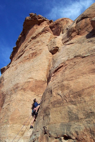 Sarah Felchlin leading pitch 3 with the summit above.
