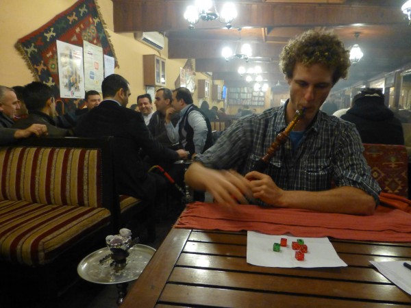 Smoking nargile and playing dice in a tea shop