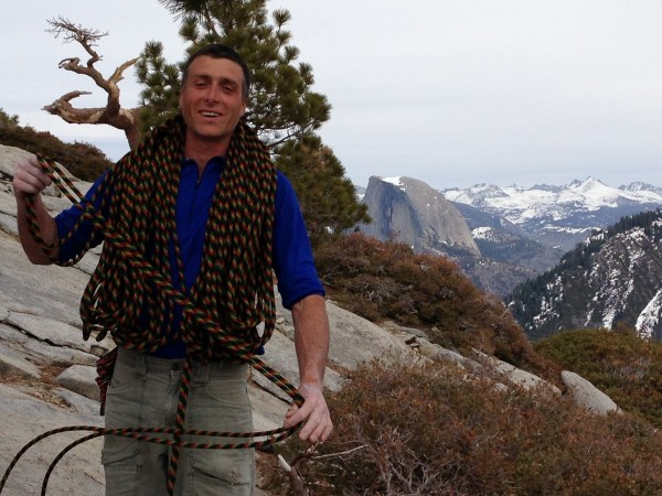 Sean Leary on the top of The Nose with half dome in the back