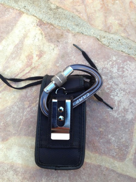 Connecting the iPhone holster case to a locking carabiner. It's import...