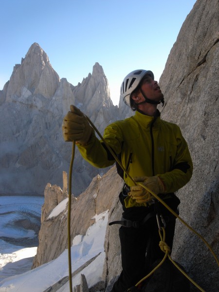 Belaying on Cerro Torre with Fitz Roy in the background.