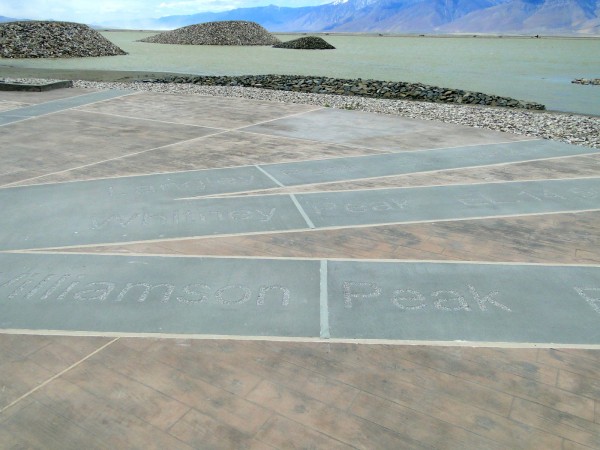 Markers in the concrete denoting prominent mountains