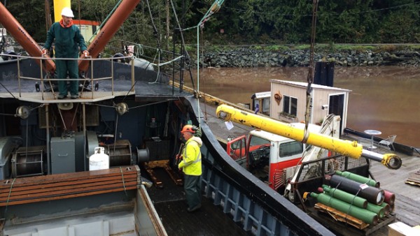 1.5 unloading supplies at the logging camp.