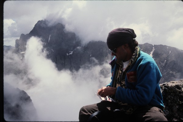 Rolling up a roll-yer-own cigarette on the summit of Kit Carson.  Ch...