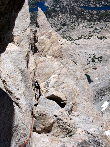 Me downclimbing through the keyhole on pitch 6