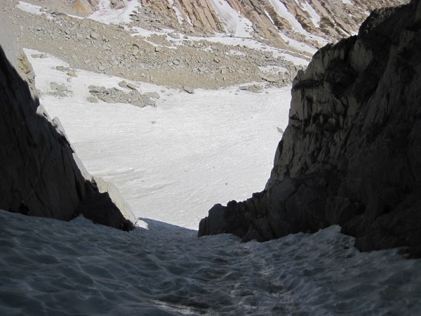 3 climbers barely visible along the ice/rock margin in the shade - Nor...