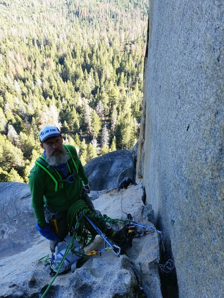 Mike at the belay, atop pitch 4 with Gary moving up the stegosaurus ju...