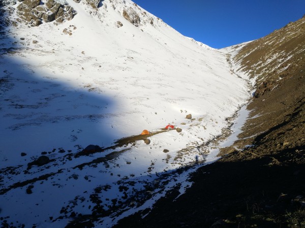 Basecamp at about 3000m along an icy stream that lead to the border. S...