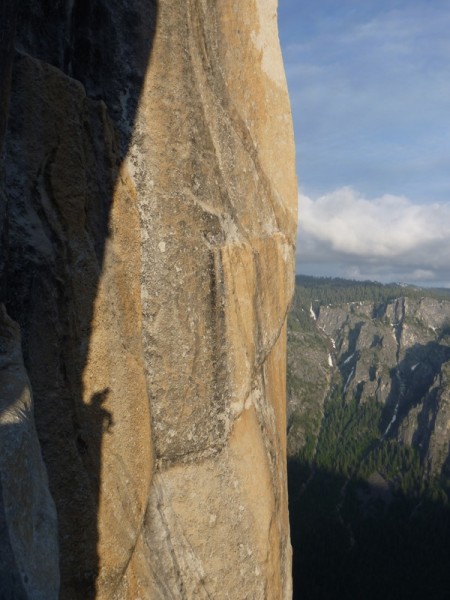 the silhouette of my partner on long ledge